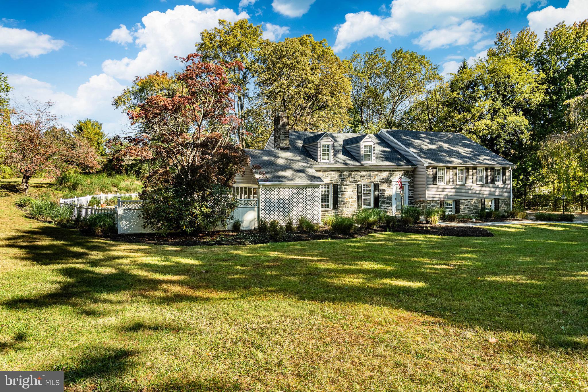 657 Walker Road Wayne, PA 19087 - Photo 7 of 66 a front view of a building with trees
