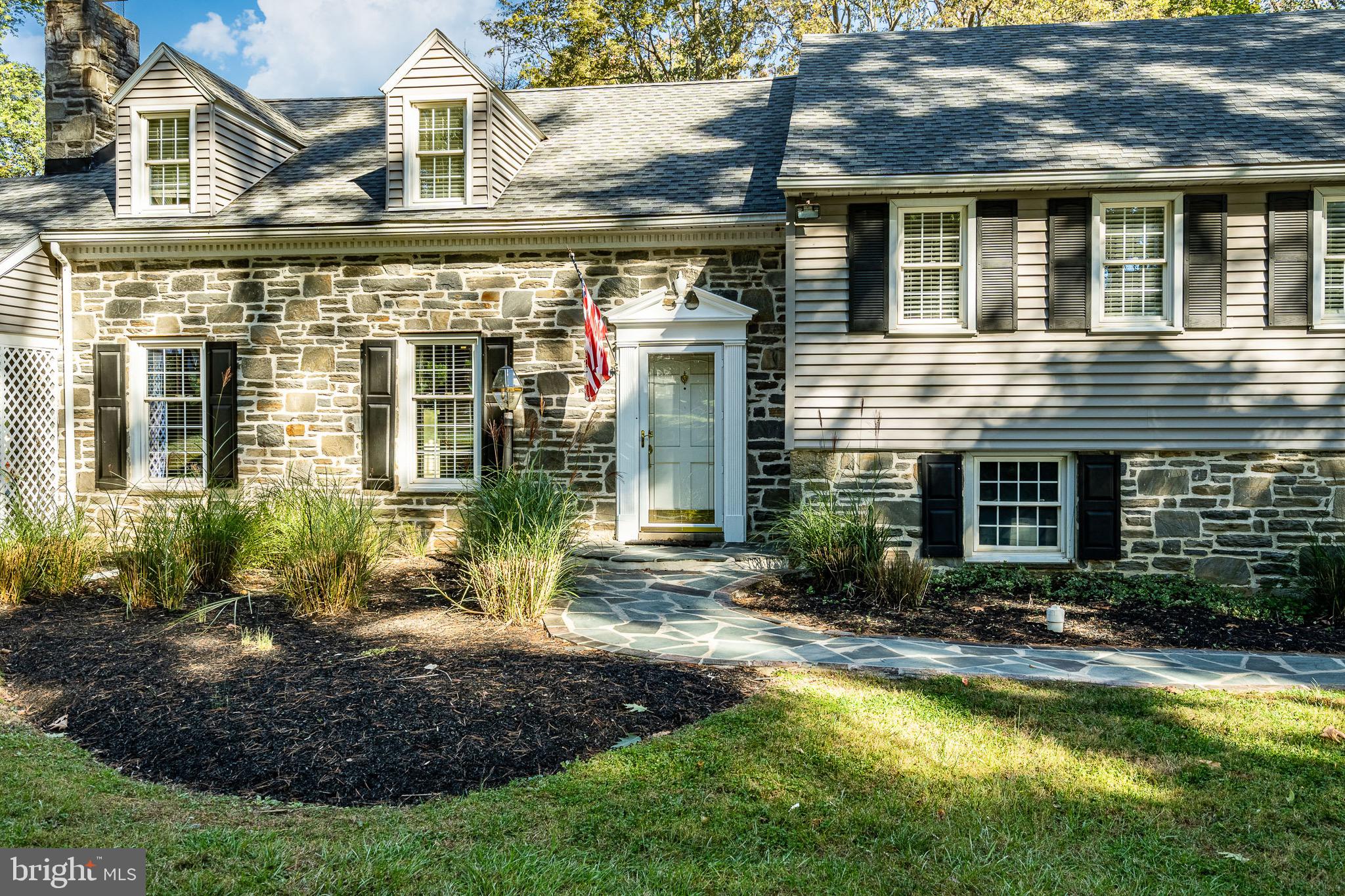 657 Walker Road Wayne, PA 19087 - Photo 9 of 66 a view of a house with a yard and plants