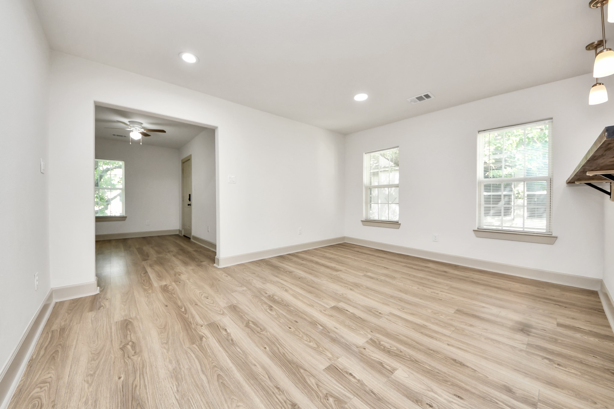 2919 Rosedale Street, Unit B Houston, TX 77004 - Photo 30 of 35 wooden floor in an empty room with a window