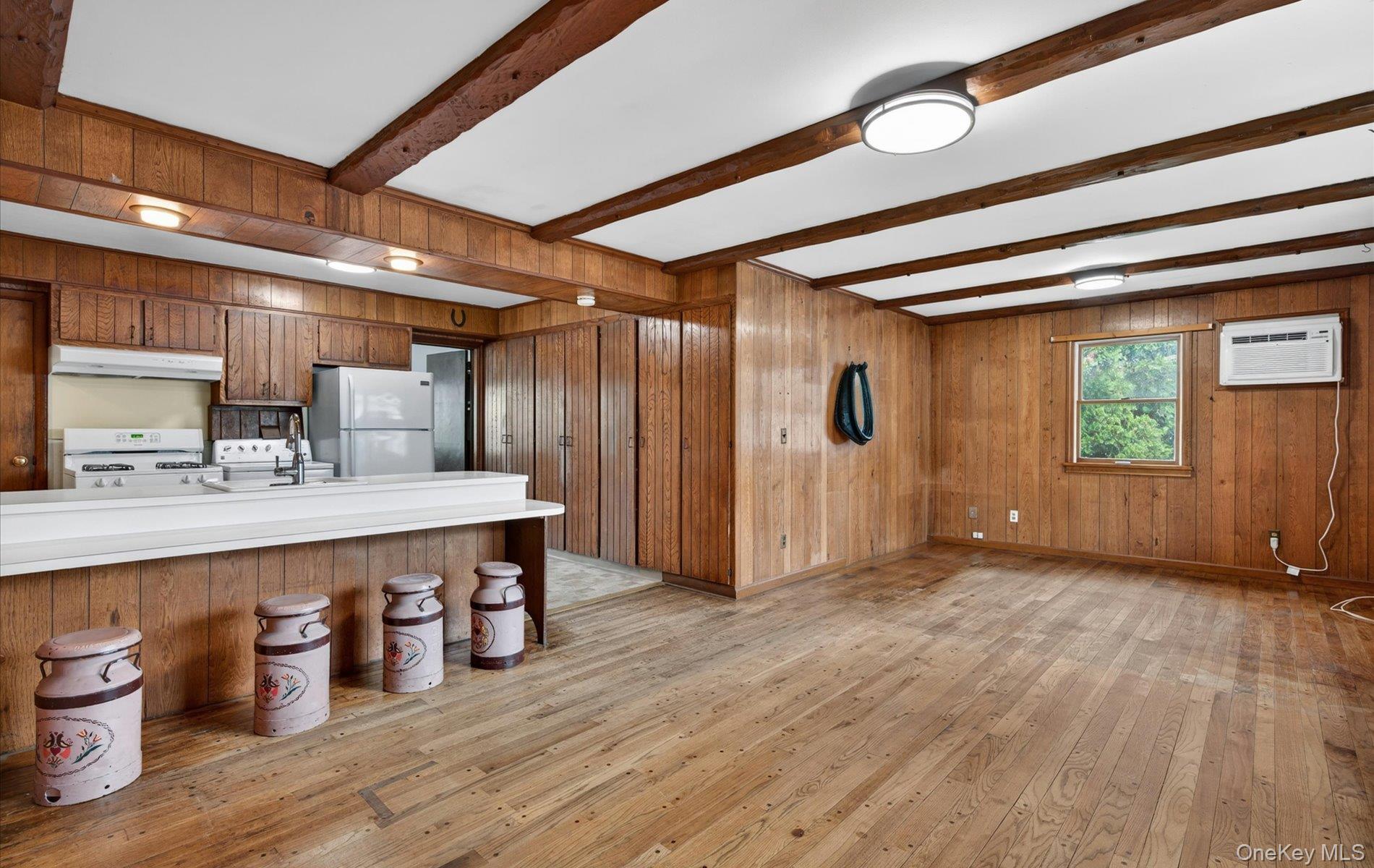 24 Purdue Road Glen Cove, NY 11542 - Photo 15 of 41 a large room with wooden floor a sink and a large window