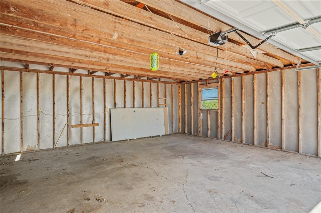9645 Scrib Lane Anna, TX 75409 - Photo 22 of 27 a view of a room with wooden walls