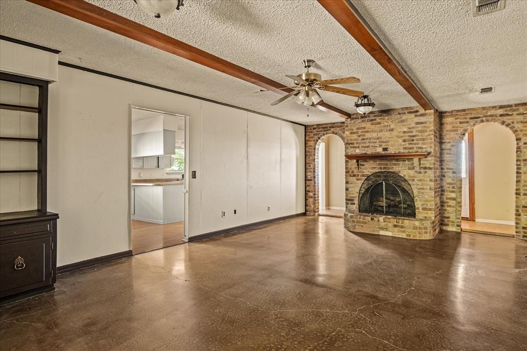 9645 Scrib Lane Anna, TX 75409 - Photo 7 of 27 a view of a livingroom with a fireplace wooden floor and staircase