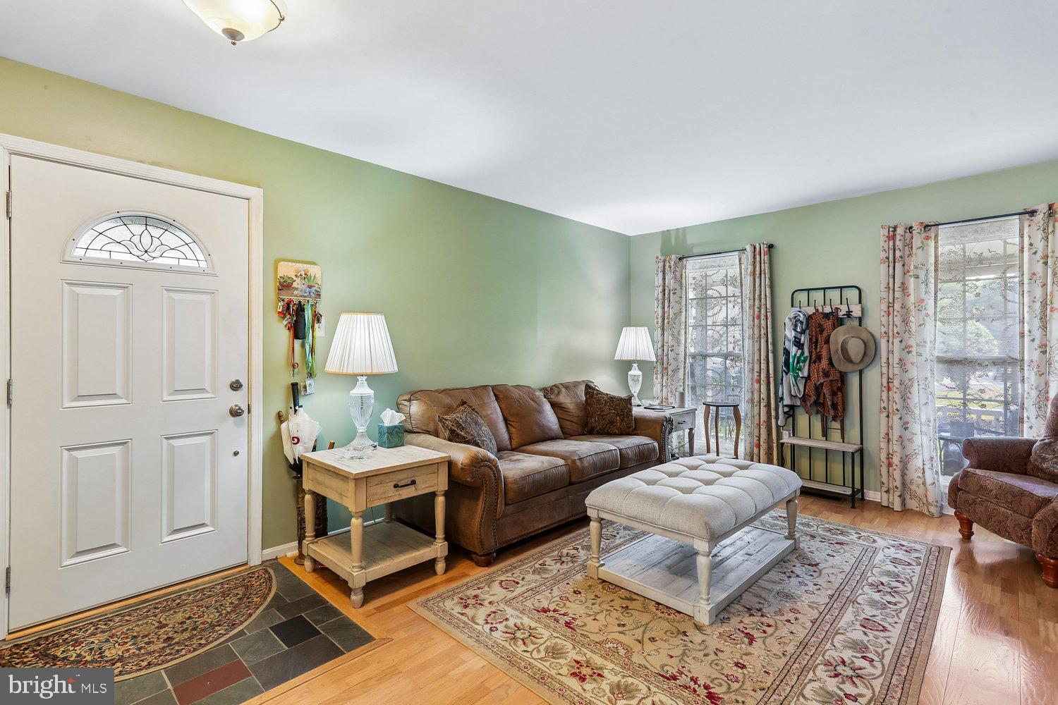 14822 Rose Trellis Place Silver Spring, MD 20906 - Photo 6 of 65 a living room with furniture and a window