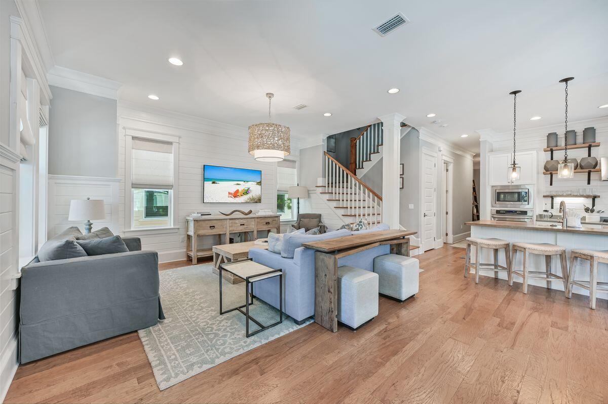 89 Clipper Street Inlet Beach, FL 32461 - Photo 12 of 49 a living room with fireplace furniture and a wooden floor