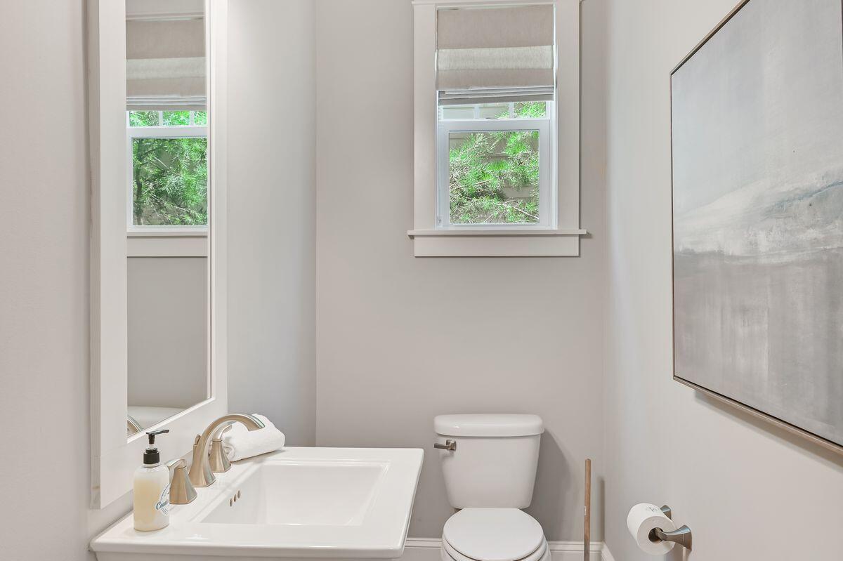 89 Clipper Street Inlet Beach, FL 32461 - Photo 16 of 49 a white toilet sitting next to a bathroom sink