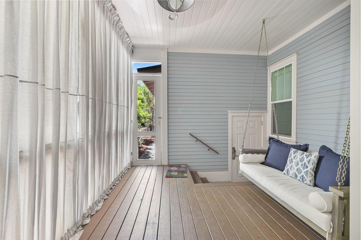 89 Clipper Street Inlet Beach, FL 32461 - Photo 21 of 49 a view of a balcony with furniture and wooden floor
