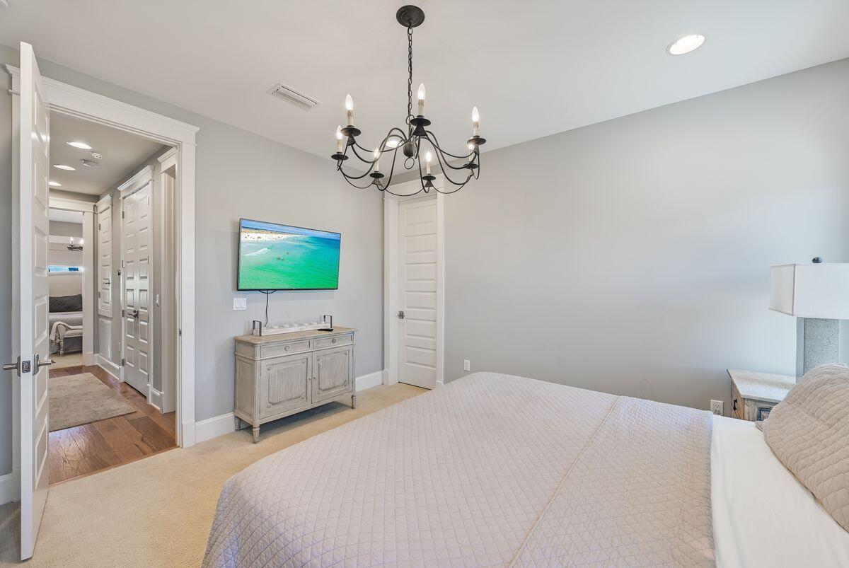 89 Clipper Street Inlet Beach, FL 32461 - Photo 23 of 49 a bedroom with a bed and a flat screen tv