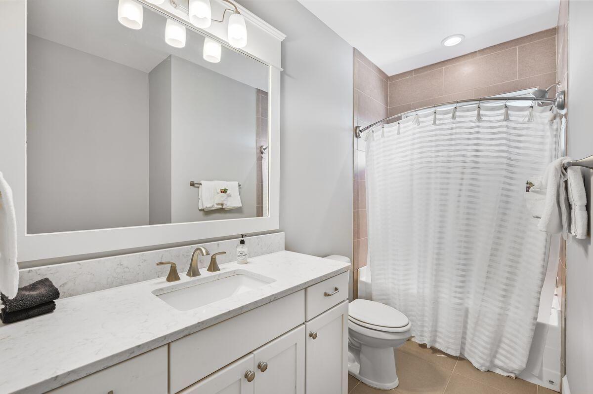 89 Clipper Street Inlet Beach, FL 32461 - Photo 25 of 49 a bathroom with a granite countertop sink toilet and shower