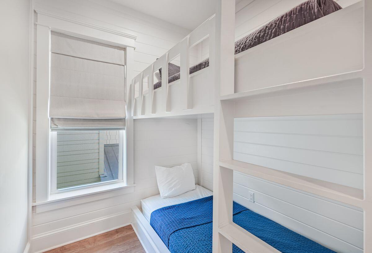 89 Clipper Street Inlet Beach, FL 32461 - Photo 26 of 49 a view of walk in closet with empty racks