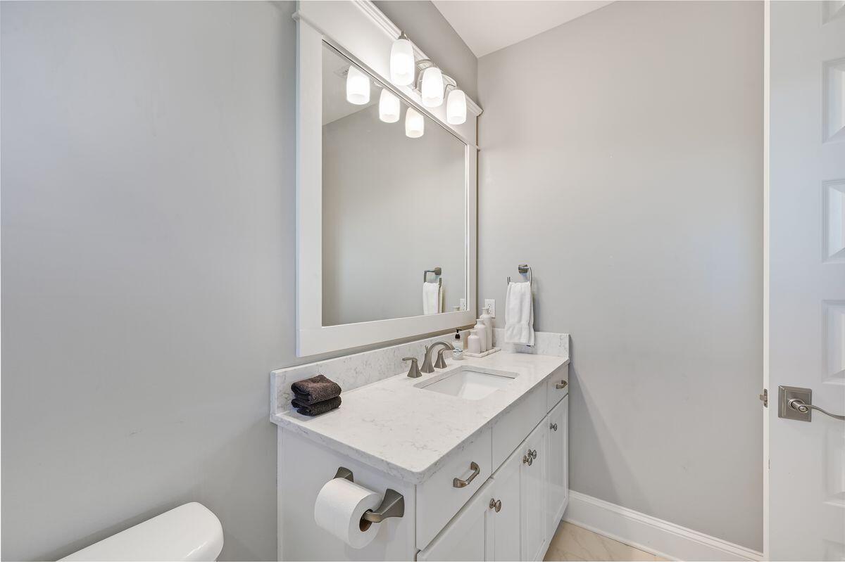 89 Clipper Street Inlet Beach, FL 32461 - Photo 30 of 49 a bathroom with a sink vanity mirror and toilet