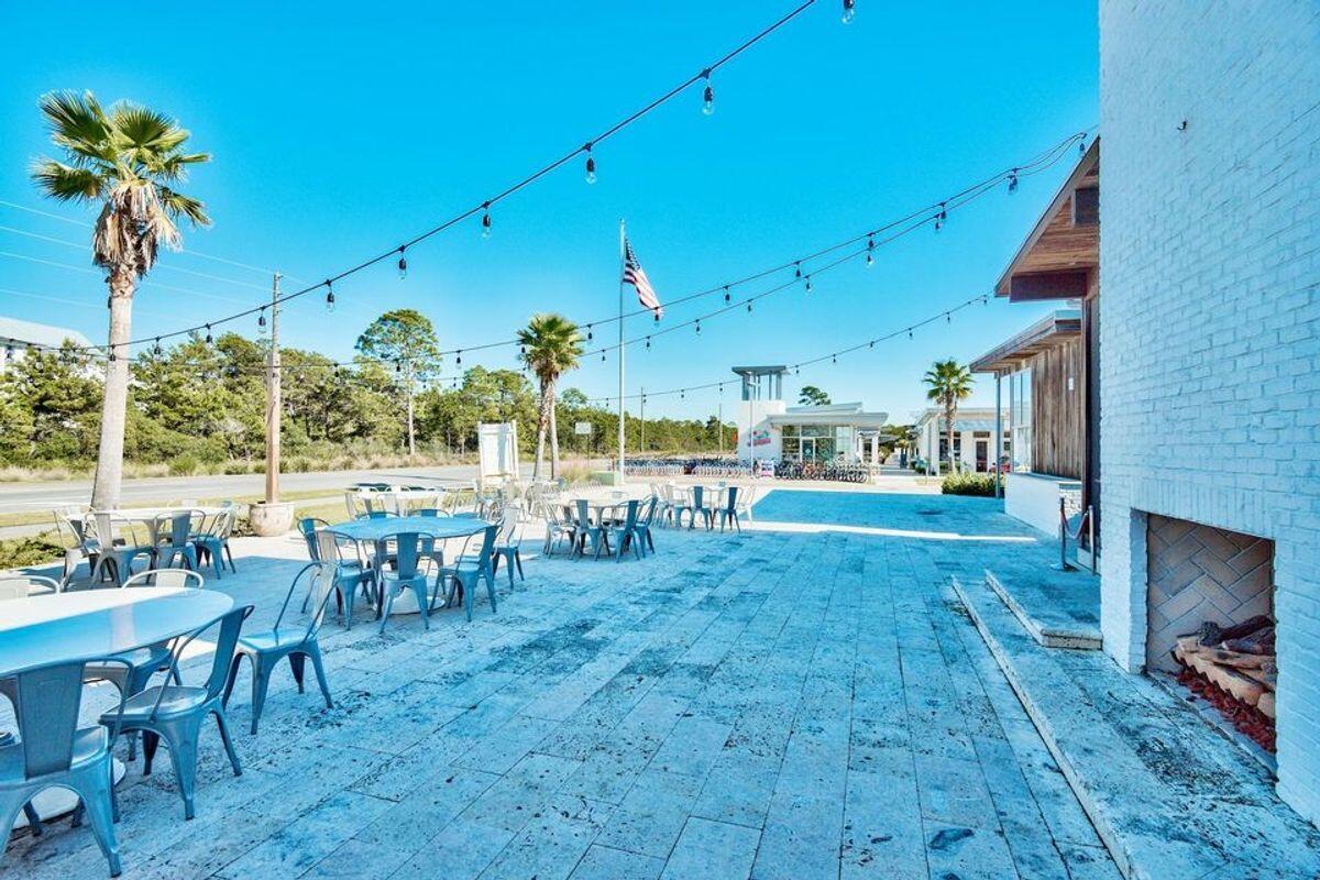 89 Clipper Street Inlet Beach, FL 32461 - Photo 41 of 49 a view of a swimming pool with a table and chairs