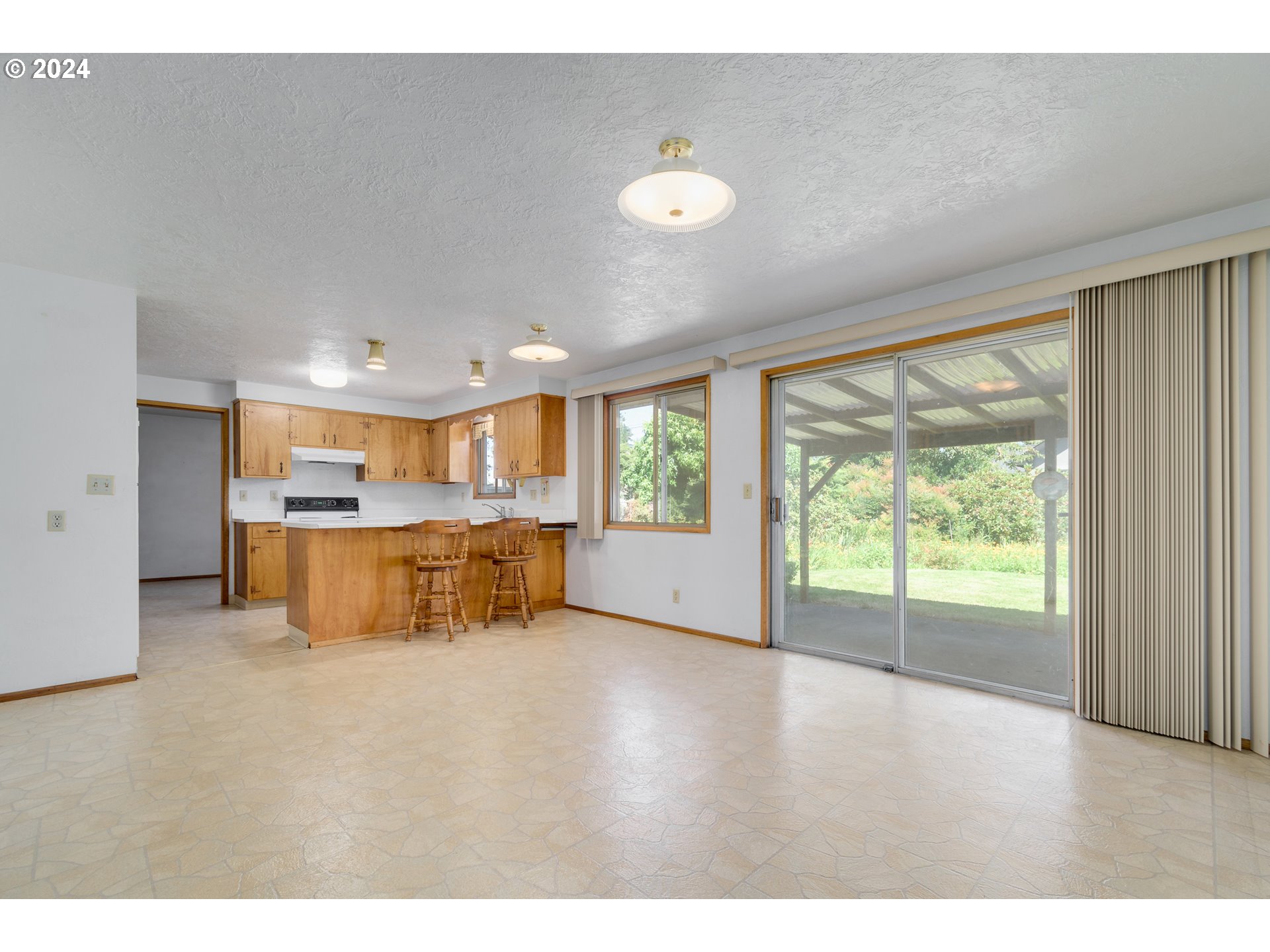 1816 Yolanda Avenue Springfield, OR 97477 - Photo 17 of 48 a view of kitchen with kitchen island and windows