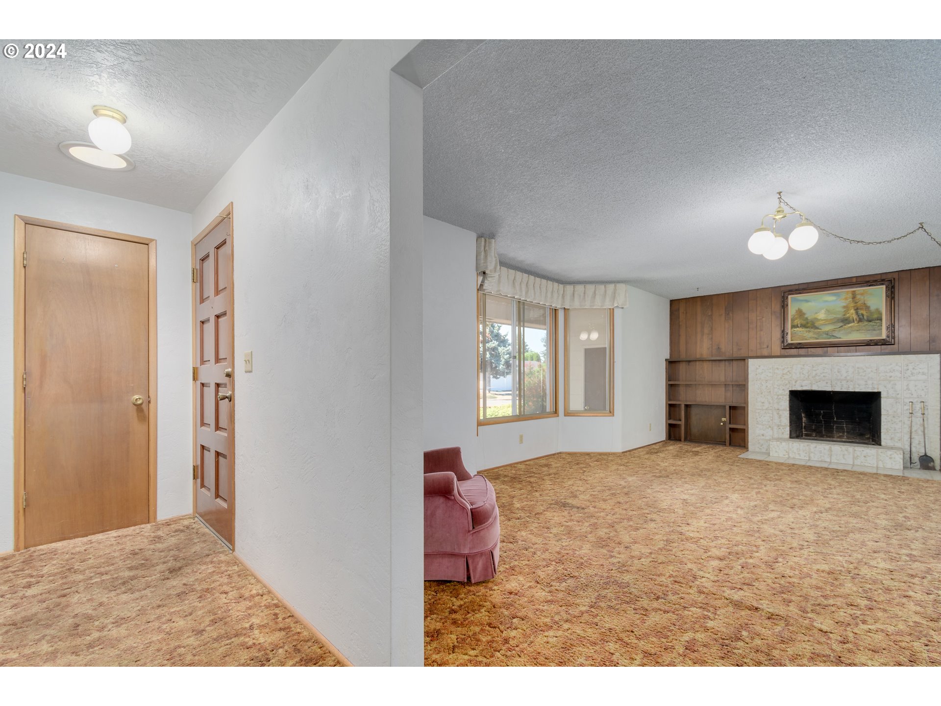 1816 Yolanda Avenue Springfield, OR 97477 - Photo 4 of 48 a view of a livingroom with a fireplace and window