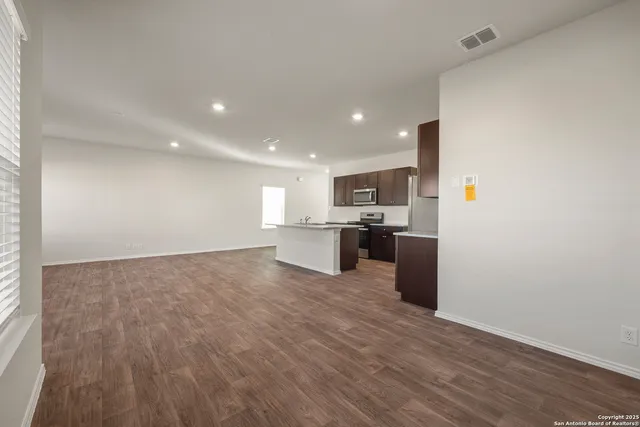 a view of kitchen with wooden floor