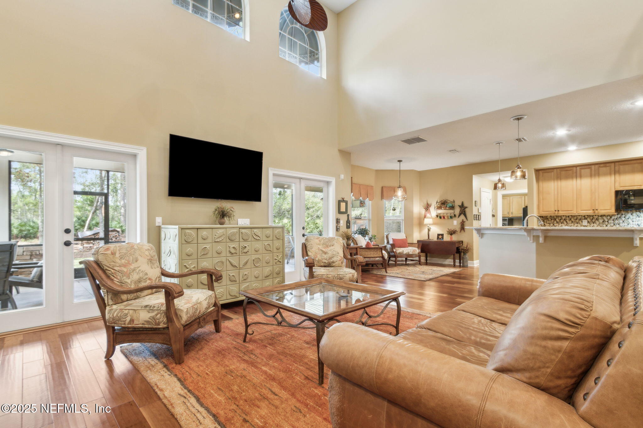 96197 Brady Point Road Fernandina Beach, FL 32034 - Photo 13 of 40 a living room with furniture and a flat screen tv