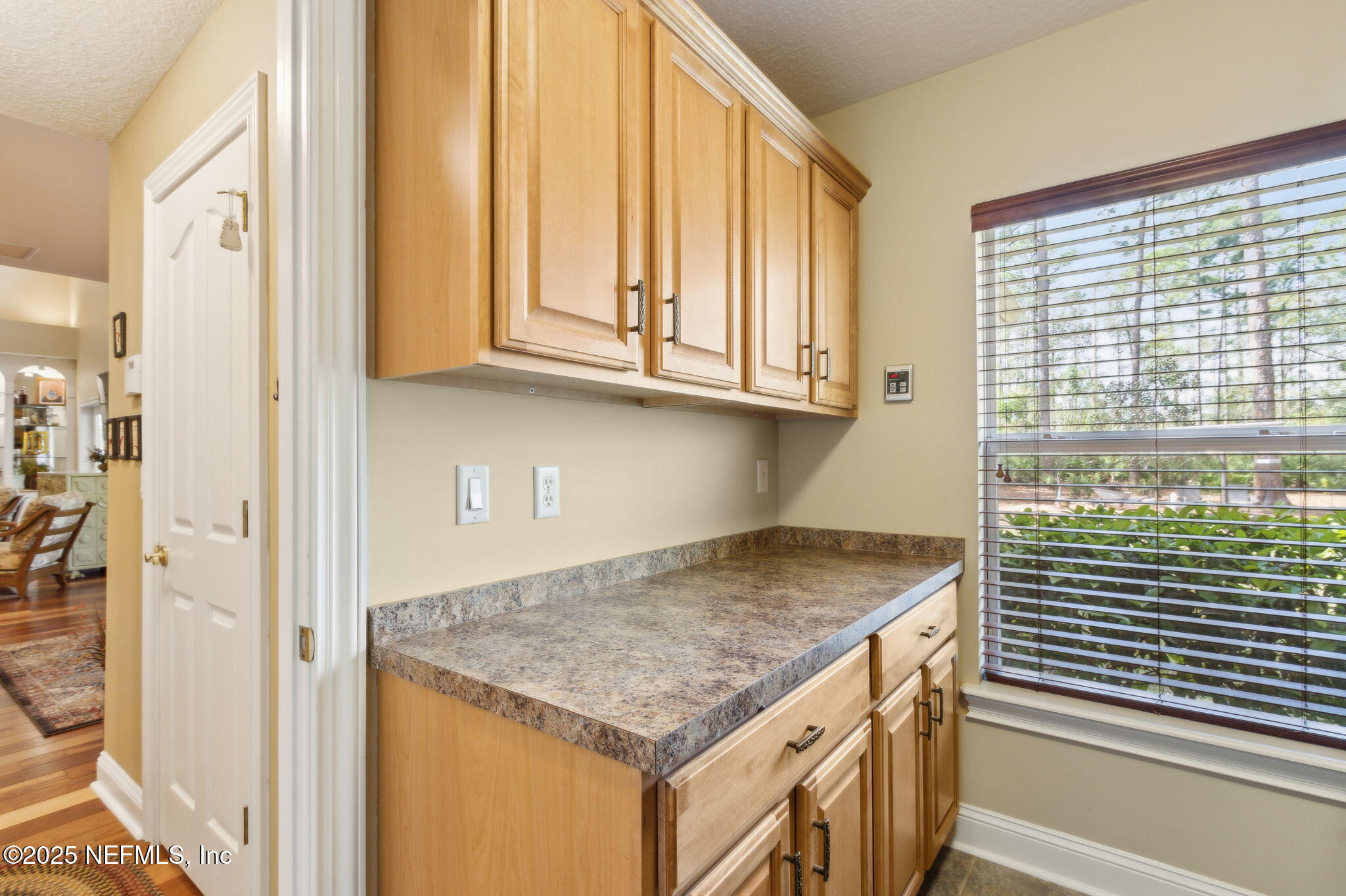 96197 Brady Point Road Fernandina Beach, FL 32034 - Photo 16 of 40 a kitchen with granite countertop a sink and a stove