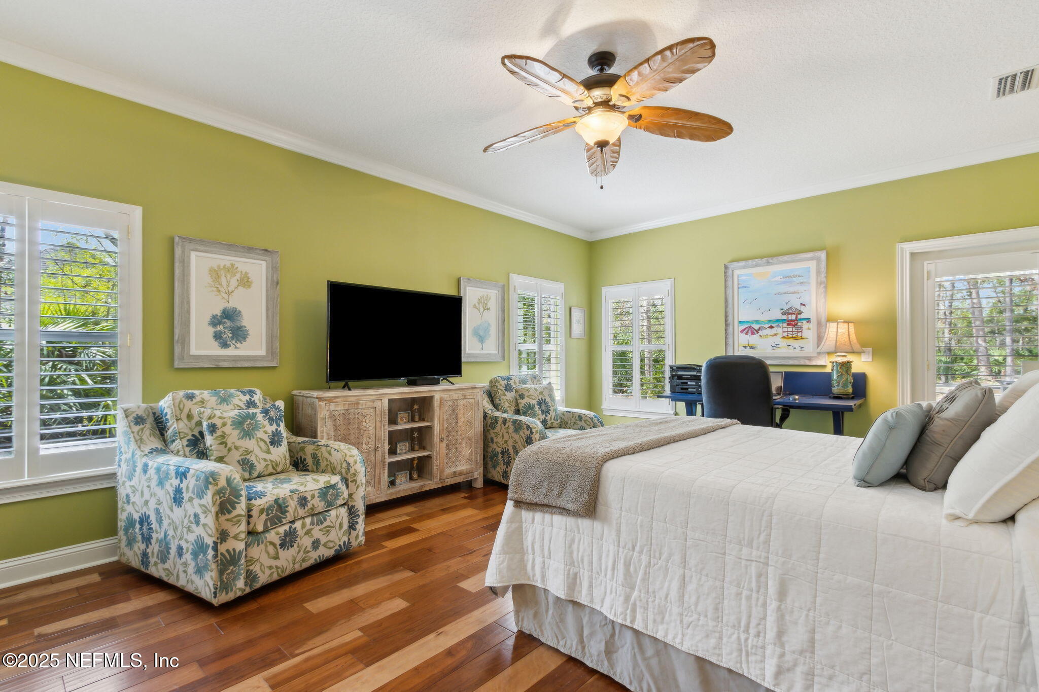 96197 Brady Point Road Fernandina Beach, FL 32034 - Photo 18 of 40 a bedroom with a bed and a flat screen tv