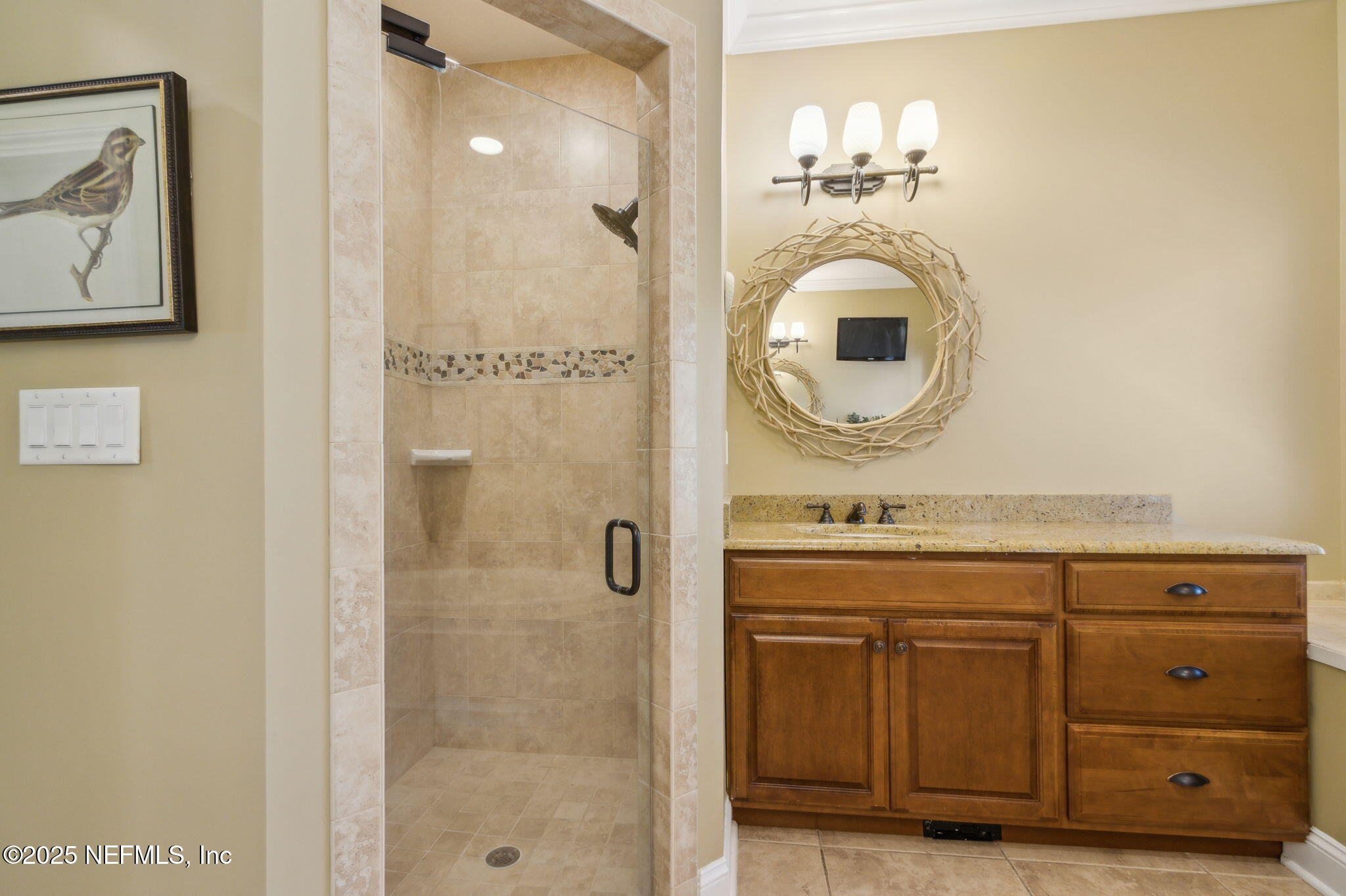 96197 Brady Point Road Fernandina Beach, FL 32034 - Photo 20 of 40 a bathroom with a granite countertop sink a mirror and shower