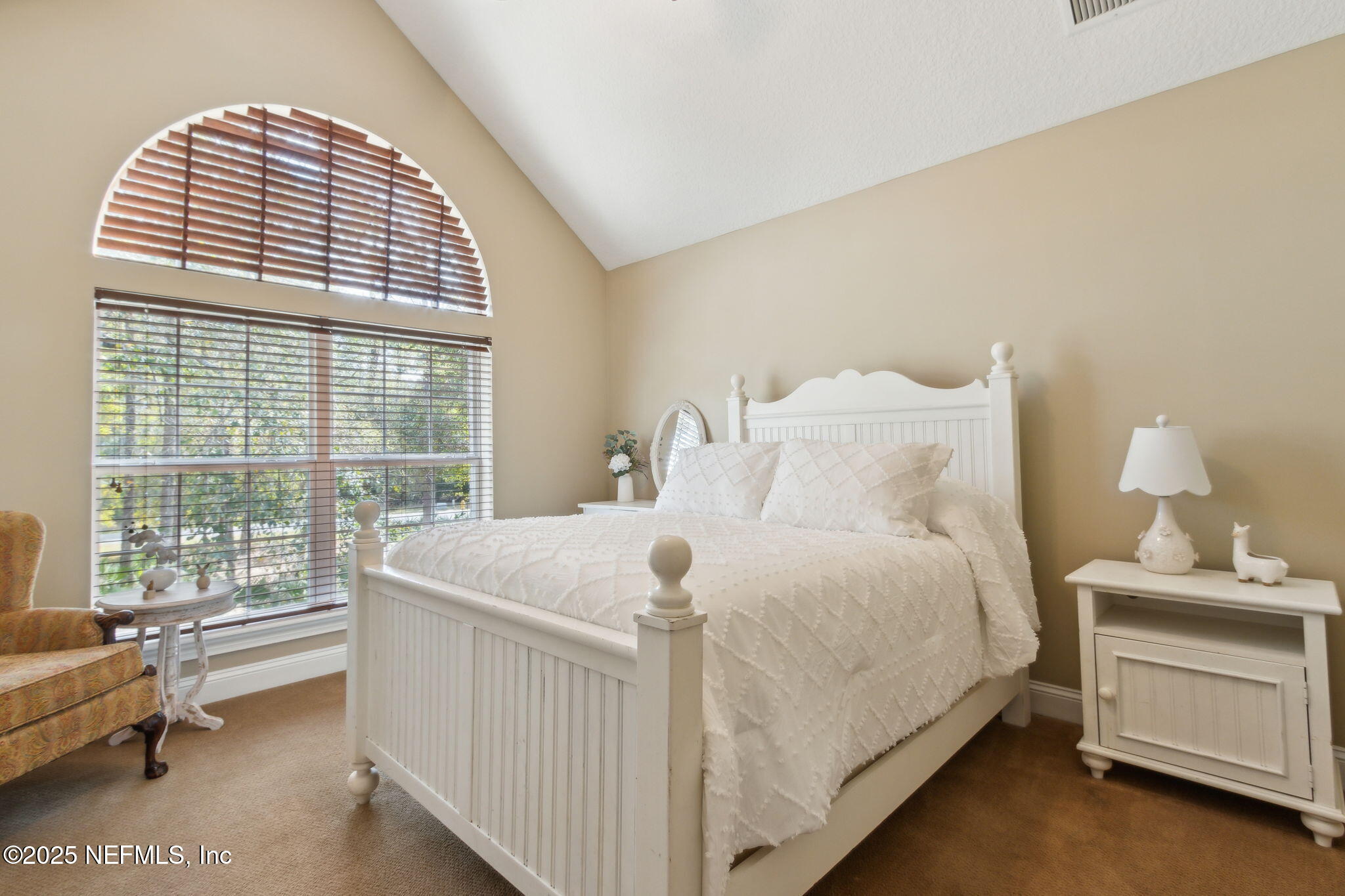 96197 Brady Point Road Fernandina Beach, FL 32034 - Photo 21 of 40 a bedroom with a bed and a window