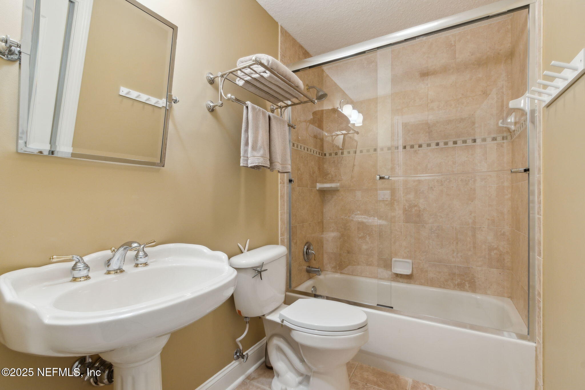 96197 Brady Point Road Fernandina Beach, FL 32034 - Photo 25 of 40 a bathroom with a sink toilet and shower