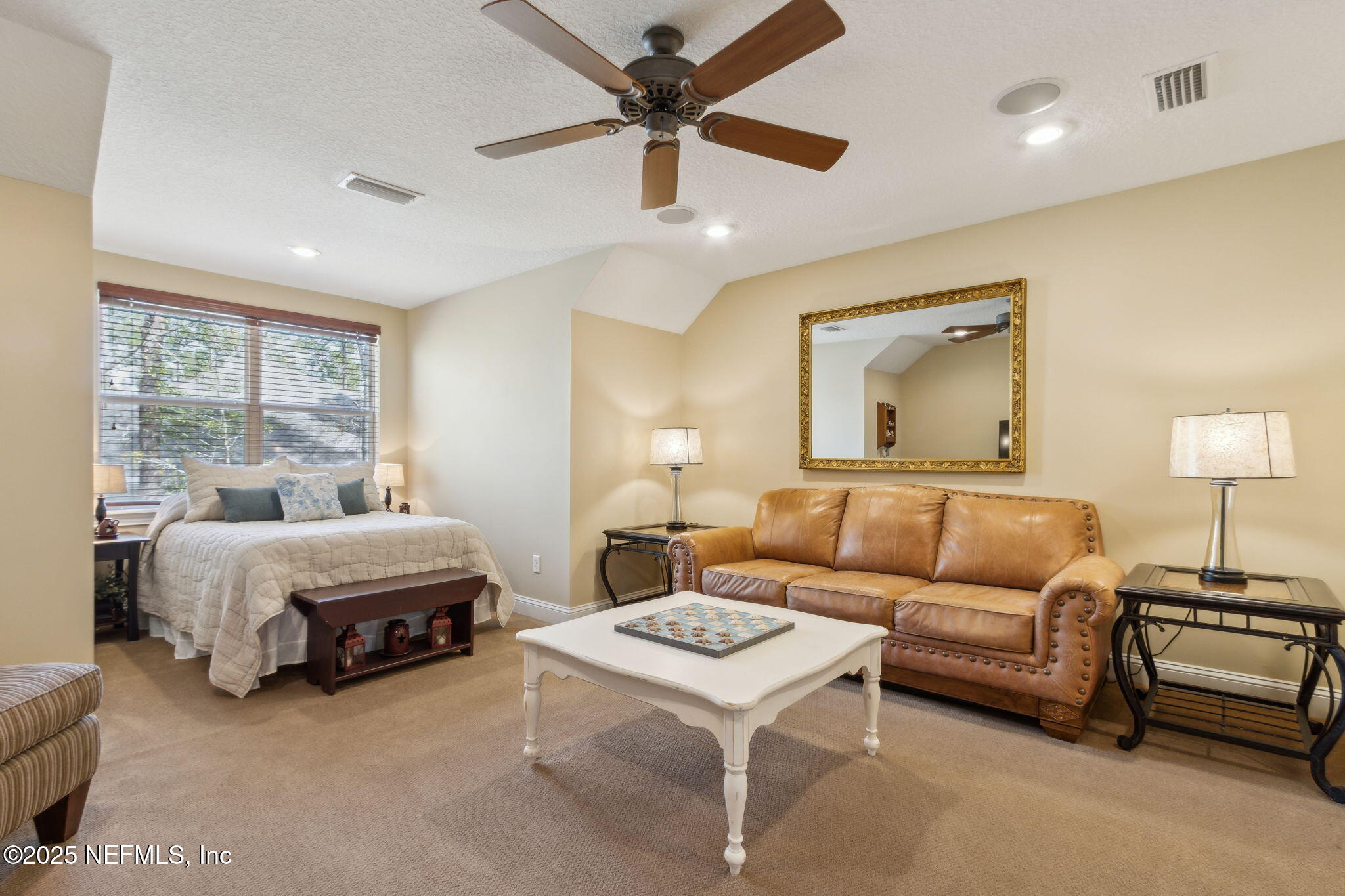 96197 Brady Point Road Fernandina Beach, FL 32034 - Photo 26 of 40 a living room with furniture and a large window