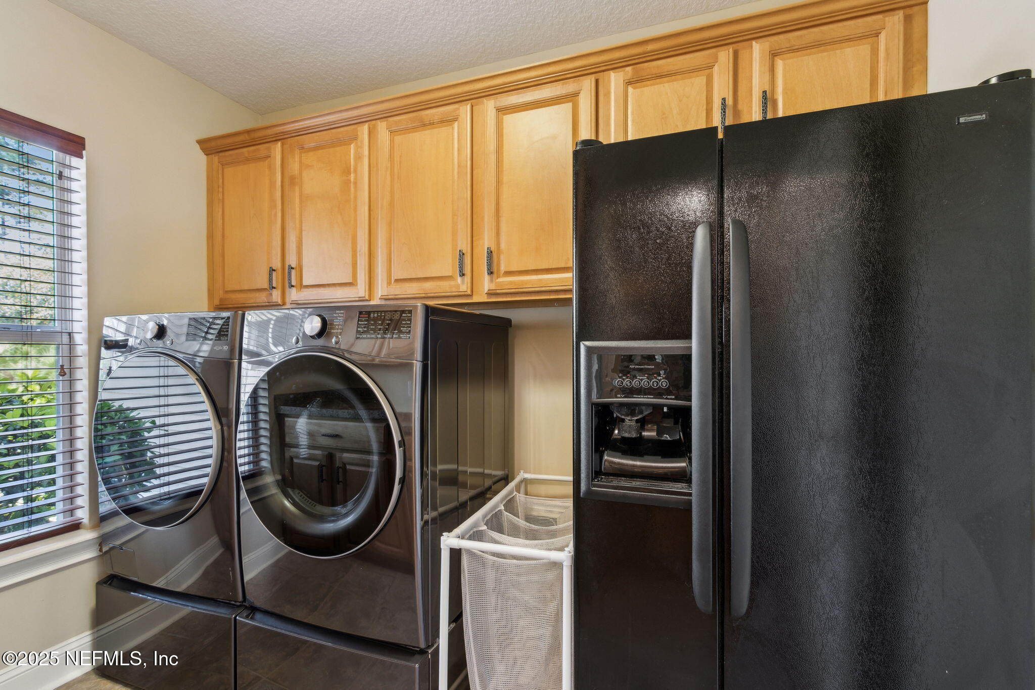 96197 Brady Point Road Fernandina Beach, FL 32034 - Photo 27 of 40 a utility room with dryer and washer