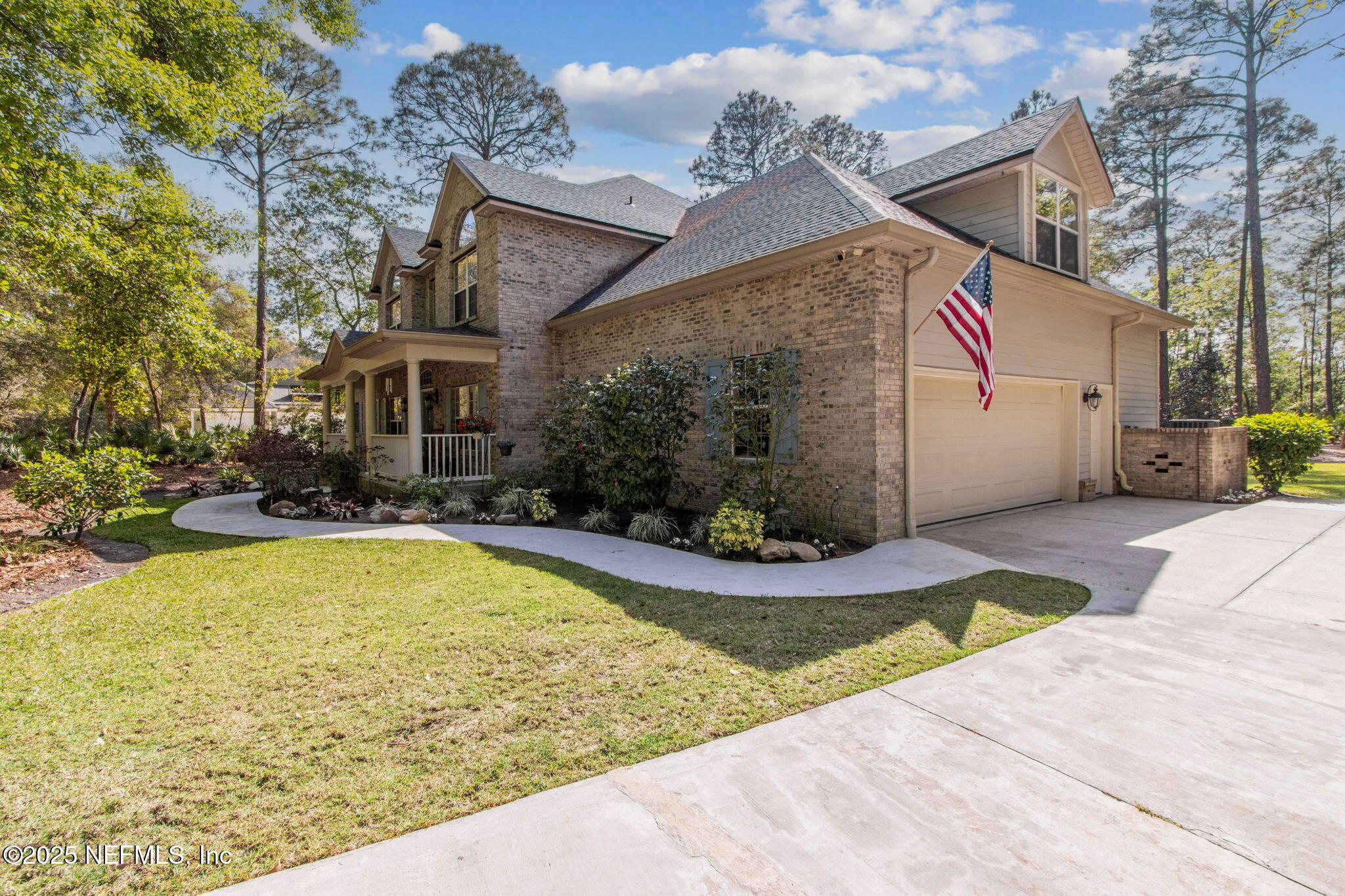 96197 Brady Point Road Fernandina Beach, FL 32034 - Photo 35 of 40 a view of a white house with a swimming pool