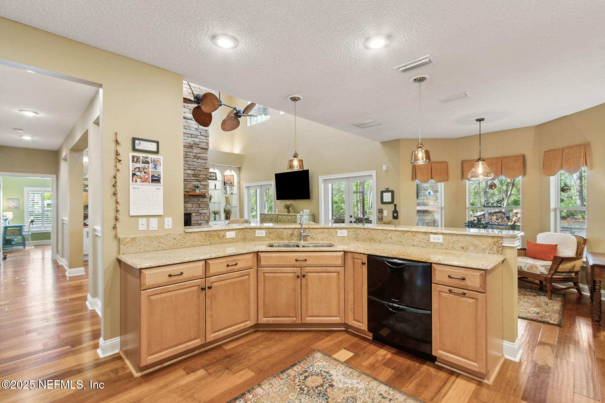 96197 Brady Point Road Fernandina Beach, FL 32034 - Photo 9 of 40 a large white kitchen with a sink and cabinets