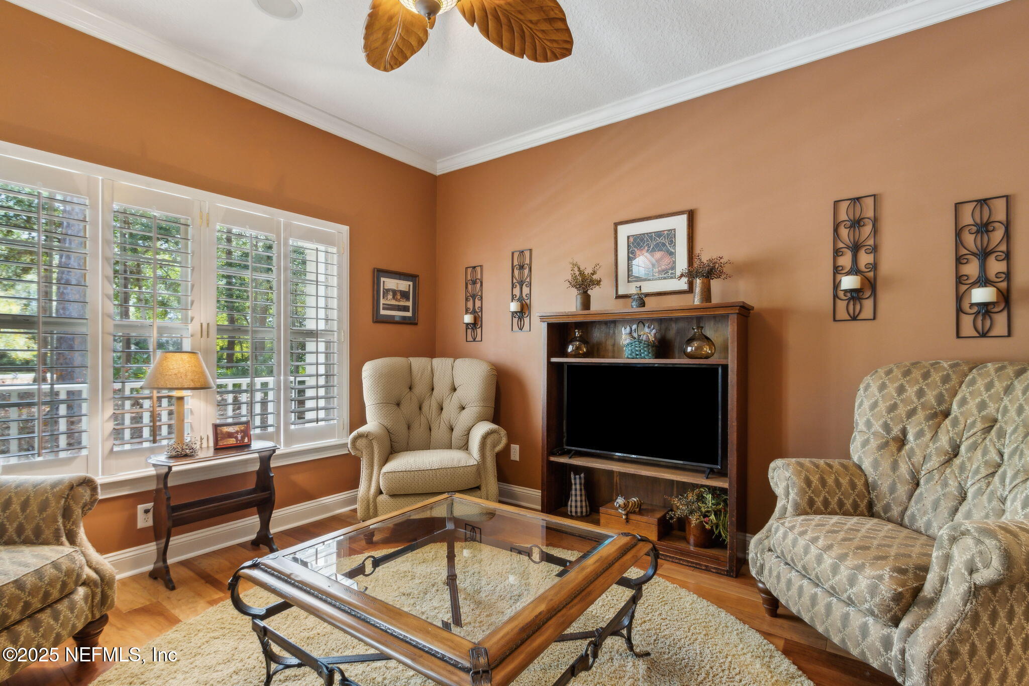 96197 Brady Point Road Fernandina Beach, FL 32034 - Photo 10 of 40 a living room with furniture a rug and a flat screen tv