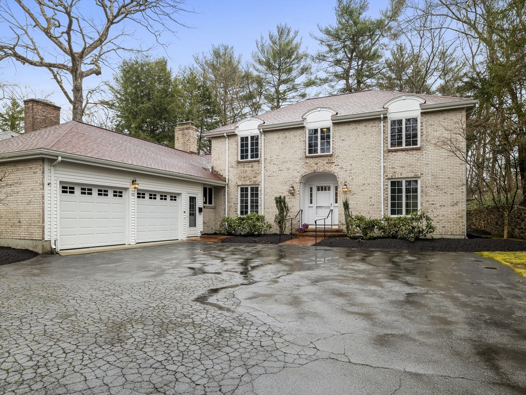 40 Audubon Road Wellesley, MA 02481 - Photo 1 of 21 a view of a white house with a large tree in front of it