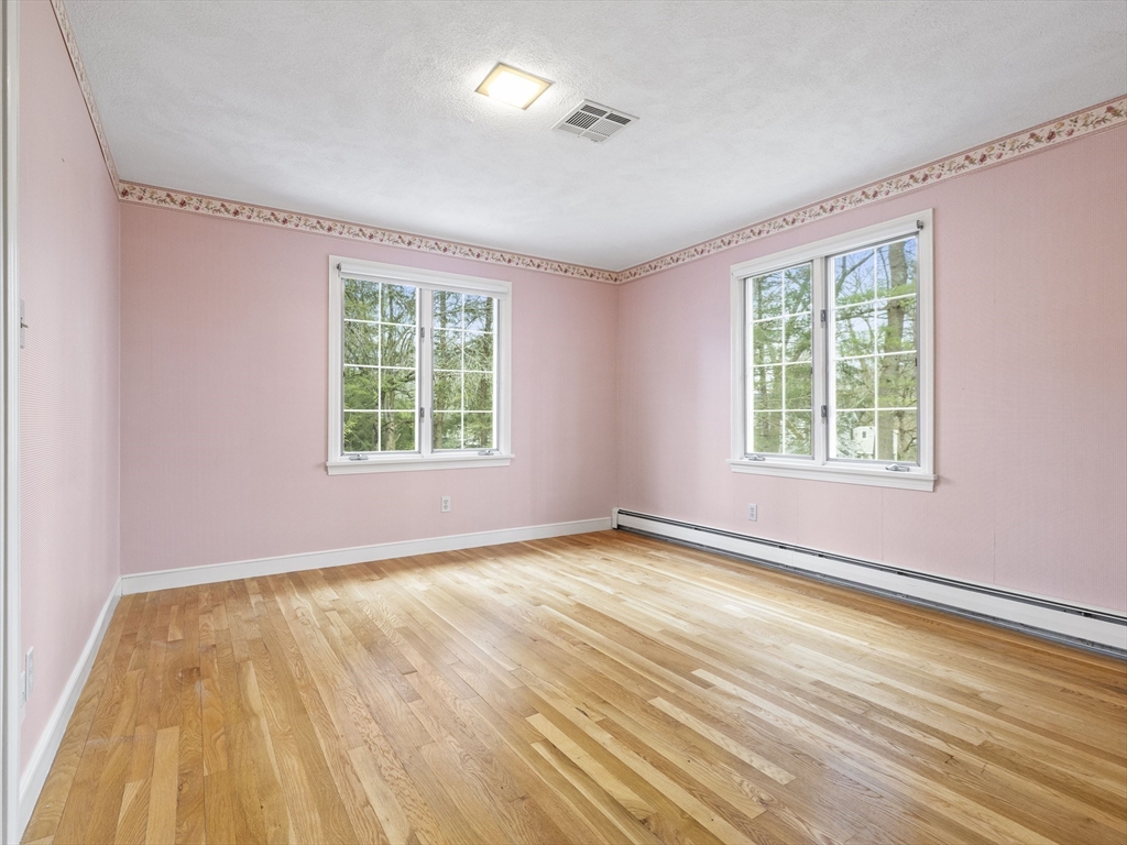 40 Audubon Road Wellesley, MA 02481 - Photo 12 of 21 a view of an empty room with a window and wooden floor