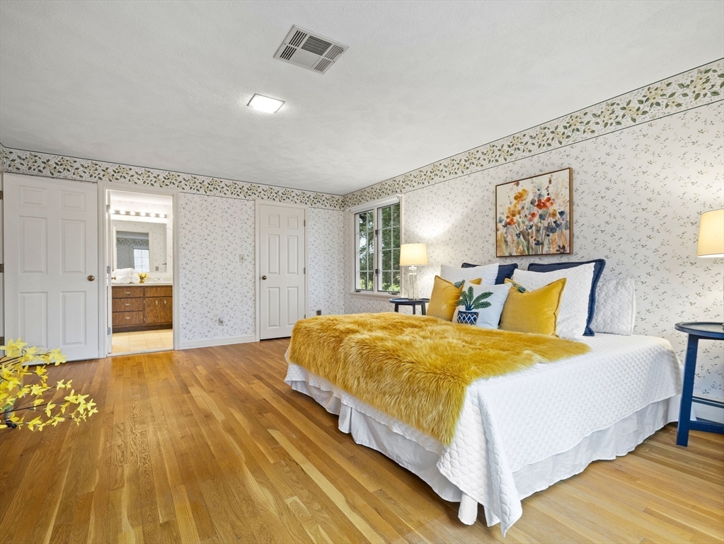 40 Audubon Road Wellesley, MA 02481 - Photo 16 of 21 a spacious bedroom with a bed and dresser