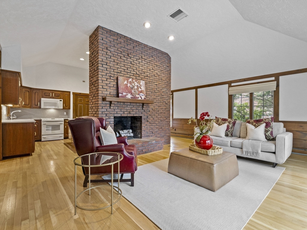 40 Audubon Road Wellesley, MA 02481 - Photo 3 of 21 a living room with furniture and a fireplace