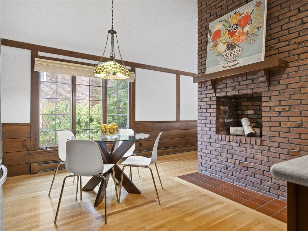 40 Audubon Road Wellesley, MA 02481 - Photo 6 of 21 a dining room with furniture a chandelier and wooden floor
