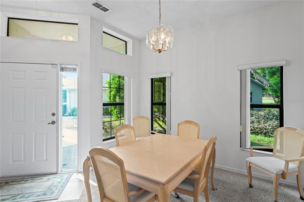 9108 Bassett Lane, Unit B New Port Richey, FL 34655 - Photo 6 of 66 a view of a dining room with furniture window and outside view