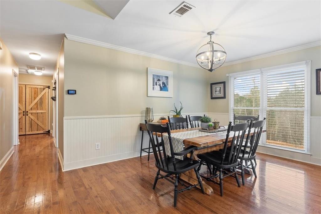 122 Horseshoe Bend Jasper, GA 30143 - Photo 14 of 47 a view of a dining room with furniture window and wooden floor