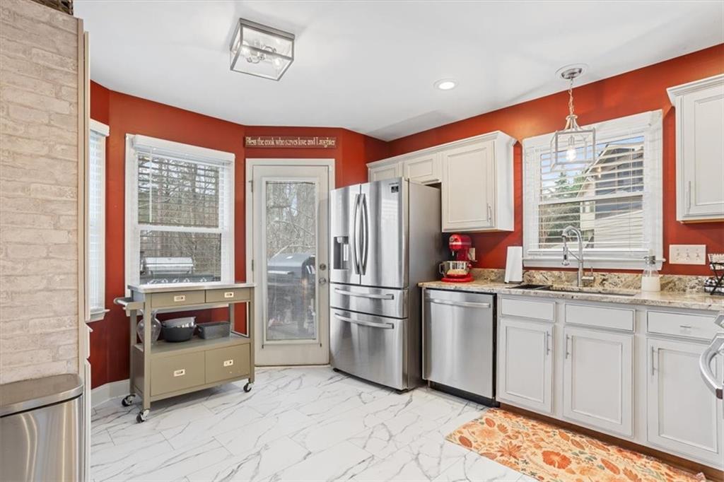 122 Horseshoe Bend Jasper, GA 30143 - Photo 18 of 47 a kitchen with stainless steel appliances granite countertop a refrigerator and a sink