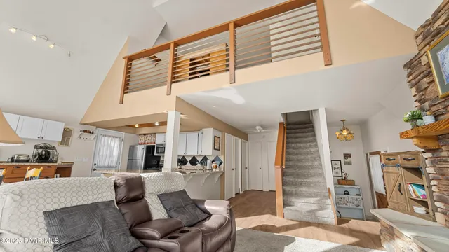 a kitchen with stainless steel appliances kitchen island granite countertop a sink and cabinets