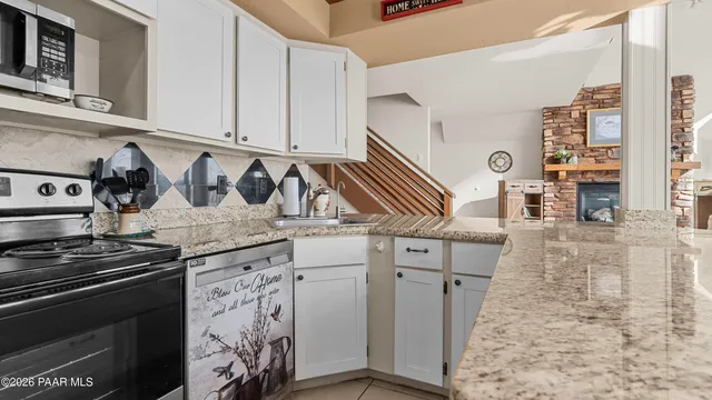 a bedroom with two beds and a dresser