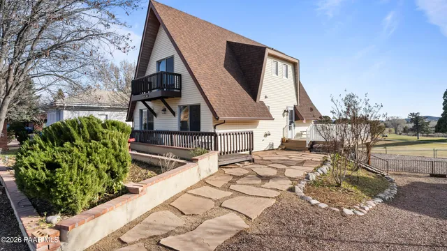 an aerial view of a house with outdoor space patio and seating space