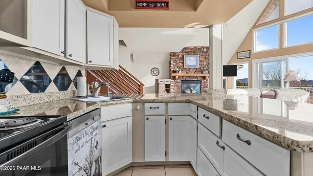 a dining room with furniture and a chandelier