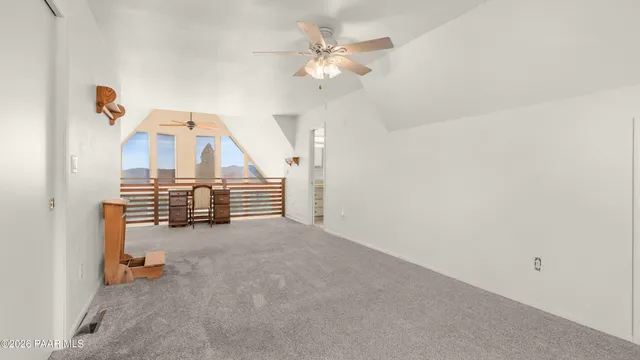 a white toilet sitting next to a shower