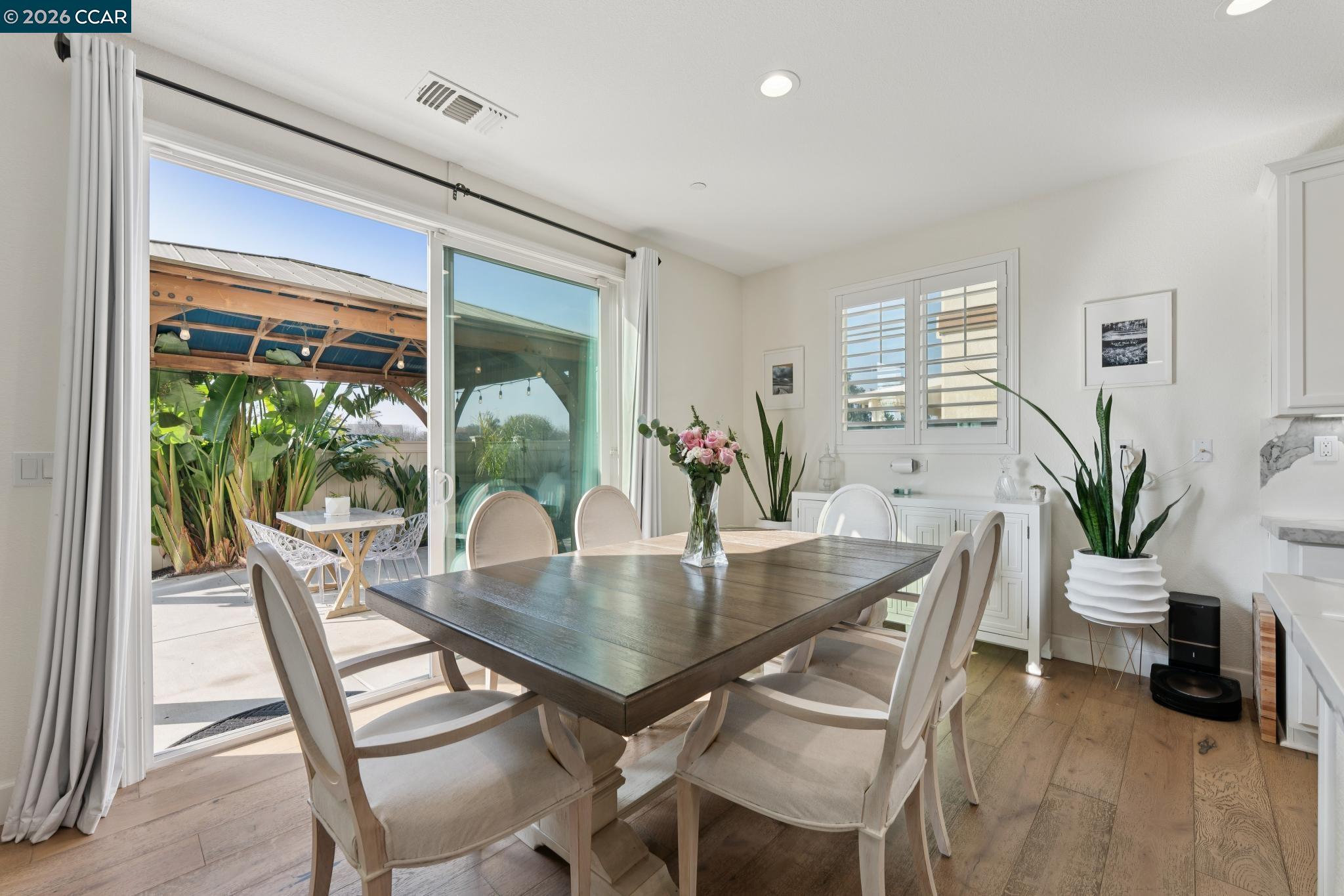 1226 Sierra Trail Road Oakley, CA 94561 - Photo 16 of 60 a dining room with furniture and wooden floor