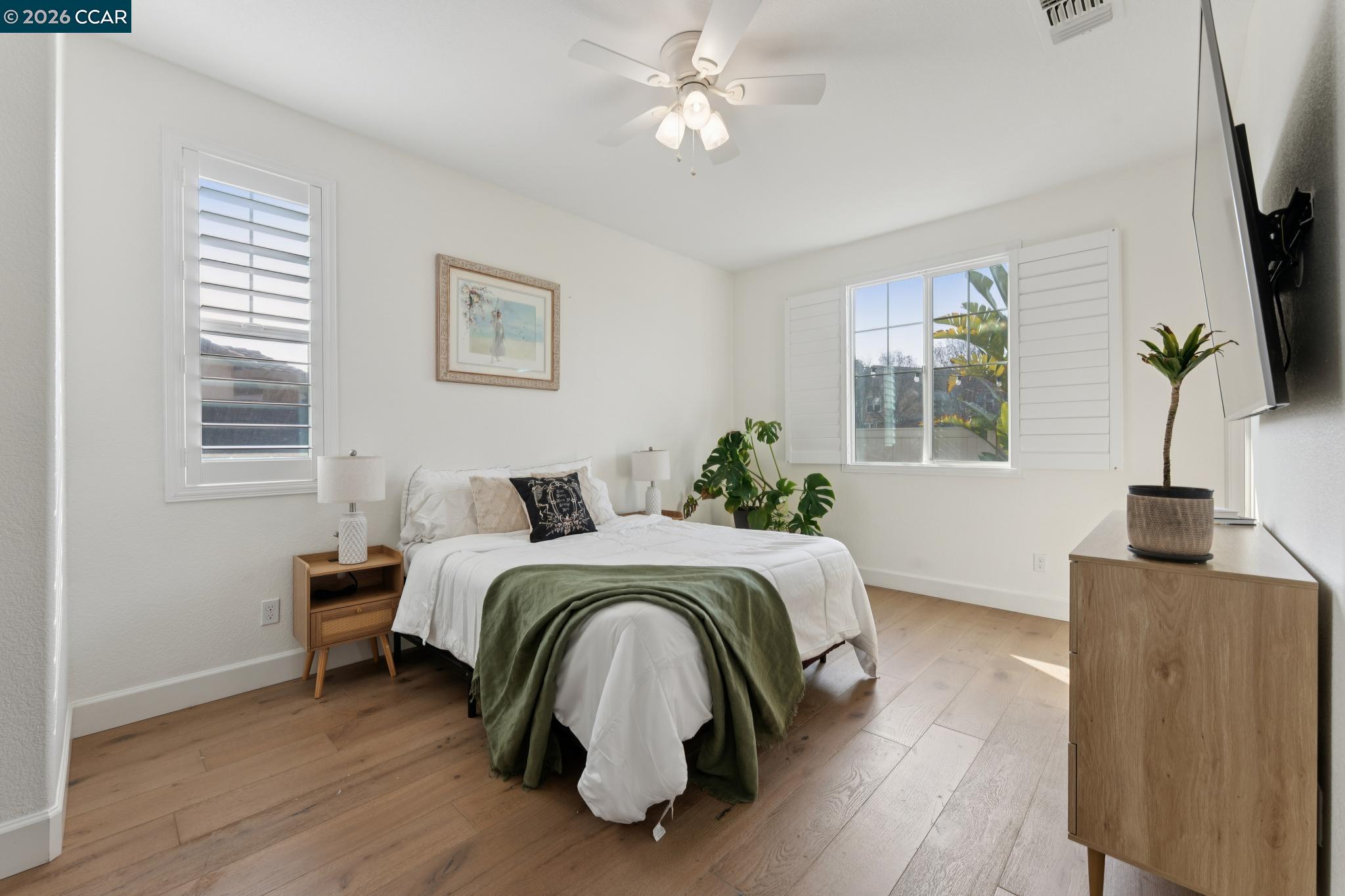 1226 Sierra Trail Road Oakley, CA 94561 - Photo 18 of 60 a bed room with a bed window and a flat screen tv