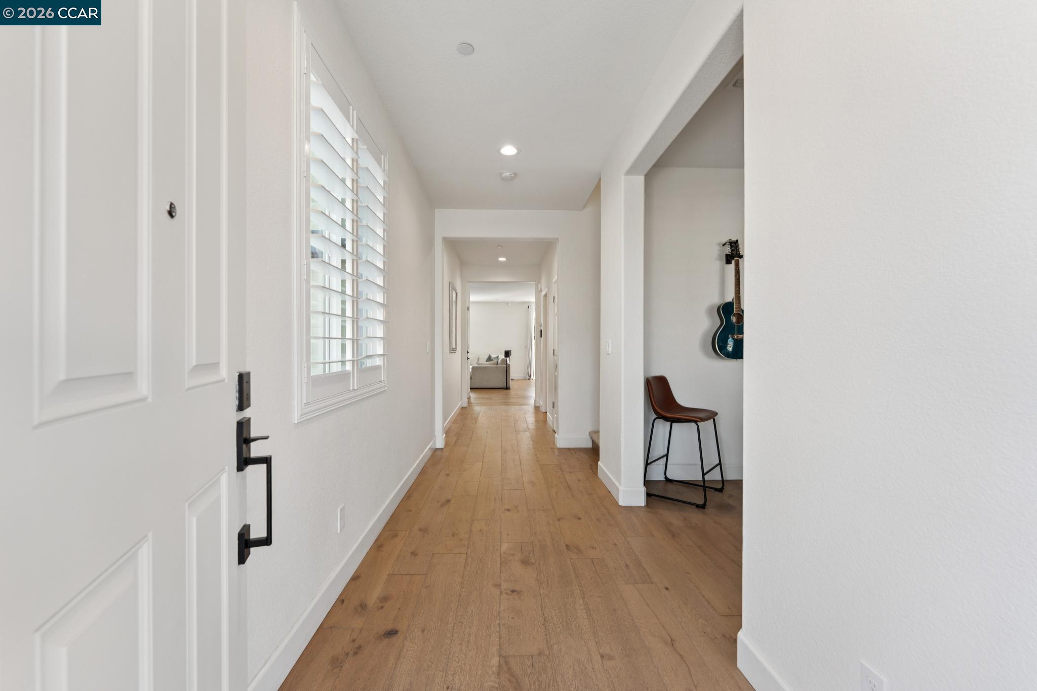 1226 Sierra Trail Road Oakley, CA 94561 - Photo 2 of 60 a view of a hallway with wooden floor and closet
