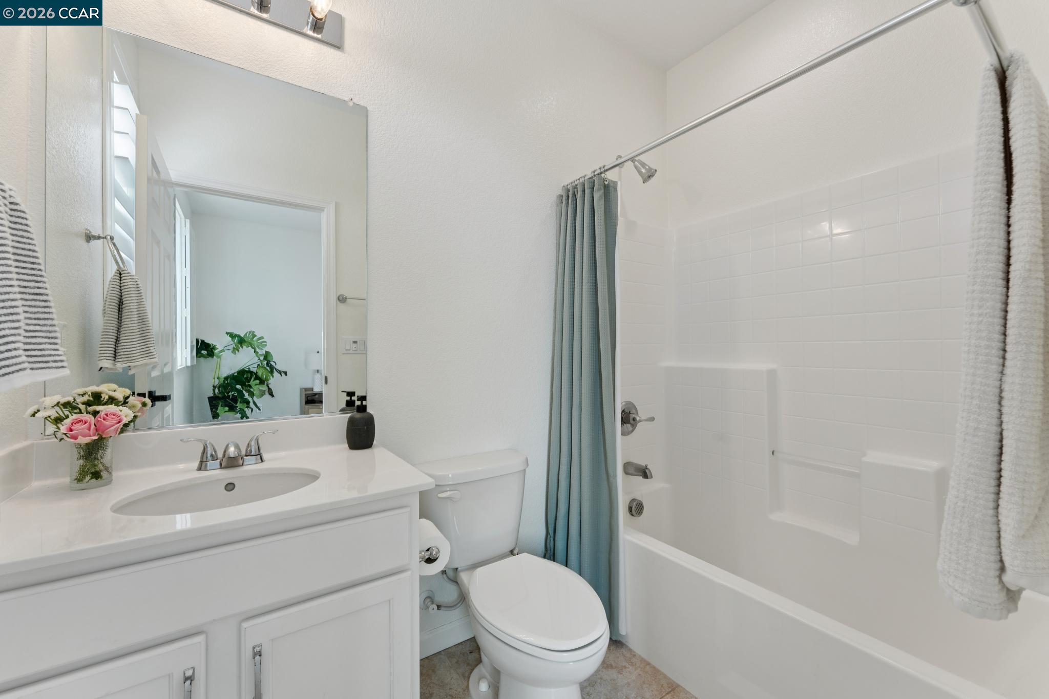 1226 Sierra Trail Road Oakley, CA 94561 - Photo 21 of 60 a bathroom with a sink toilet and shower