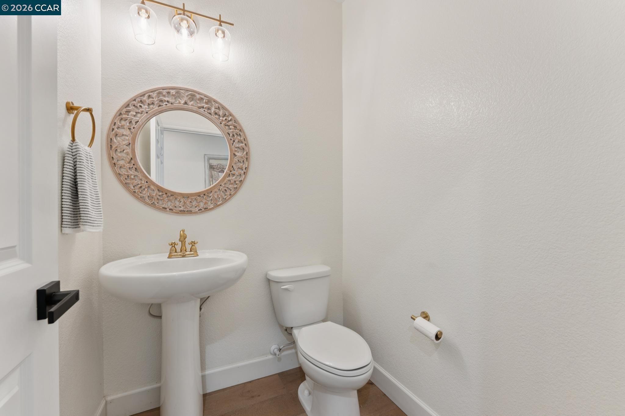 1226 Sierra Trail Road Oakley, CA 94561 - Photo 22 of 60 a bathroom with a sink and a mirror