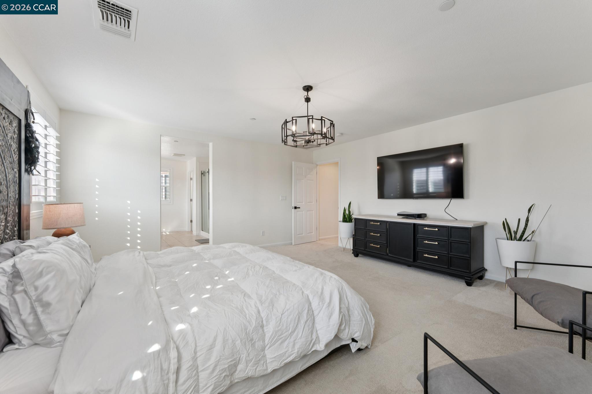 1226 Sierra Trail Road Oakley, CA 94561 - Photo 30 of 60 a bedroom with a bed and a flat screen tv