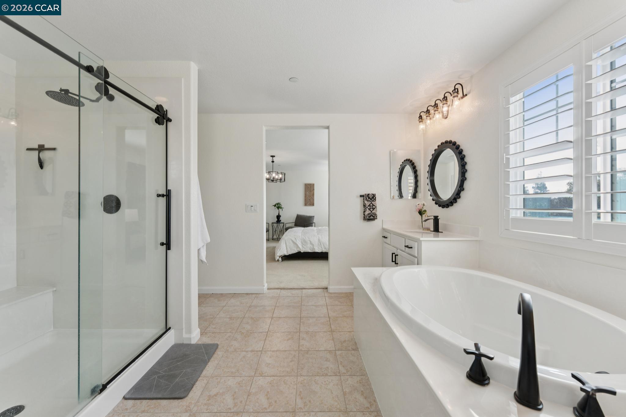 1226 Sierra Trail Road Oakley, CA 94561 - Photo 34 of 60 a spacious bathroom with a tub shower and mirror