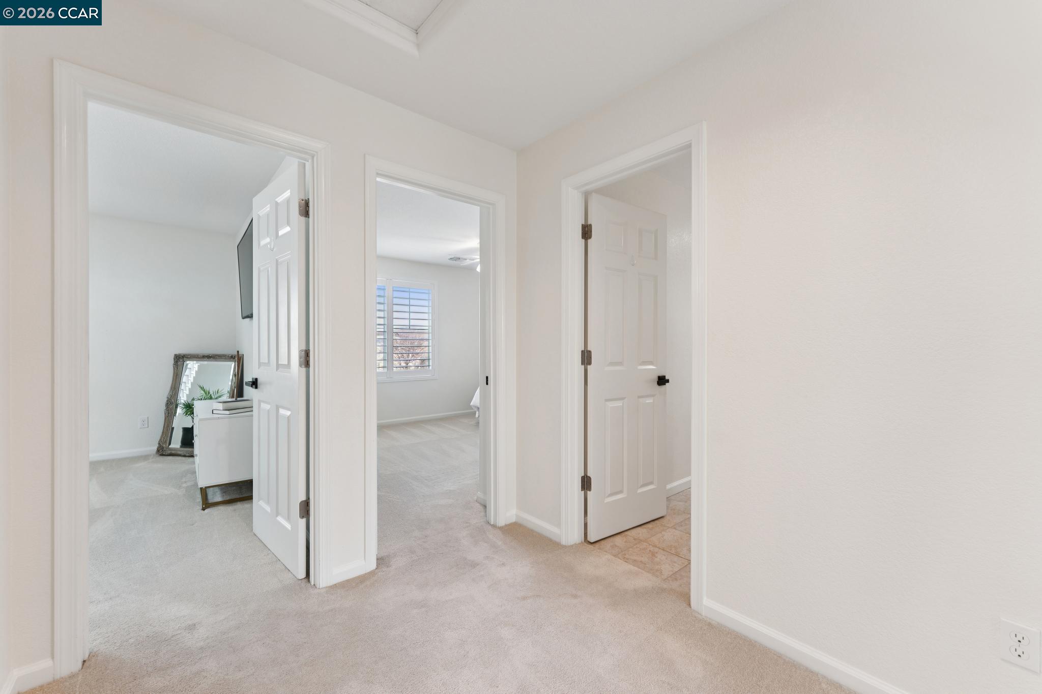 1226 Sierra Trail Road Oakley, CA 94561 - Photo 37 of 60 an empty room with white cabinet and a bathroom